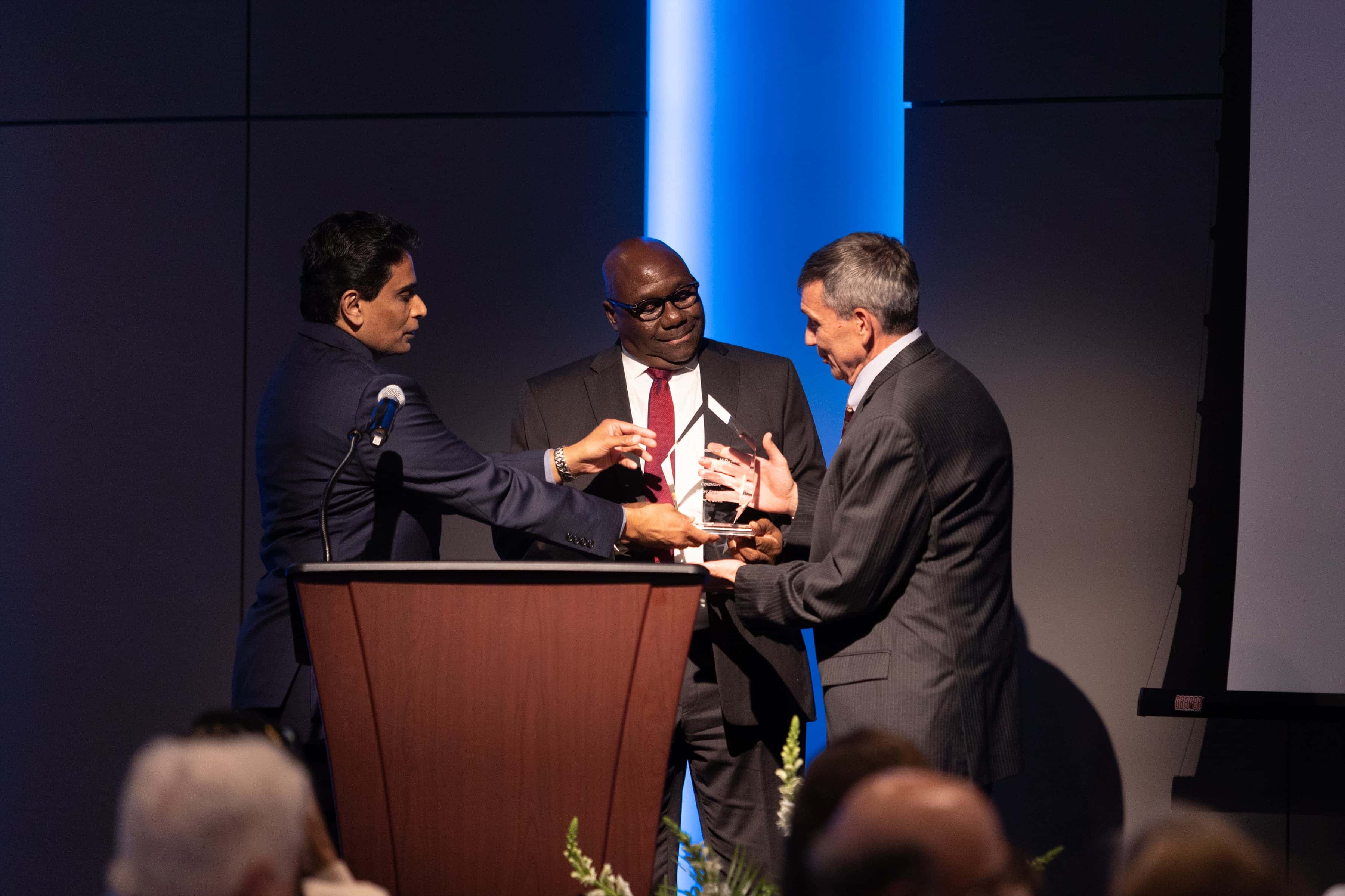 Dr. Doug Bacon Receiving Award from Dr. Claude Brunson and Dr. Anand Prem